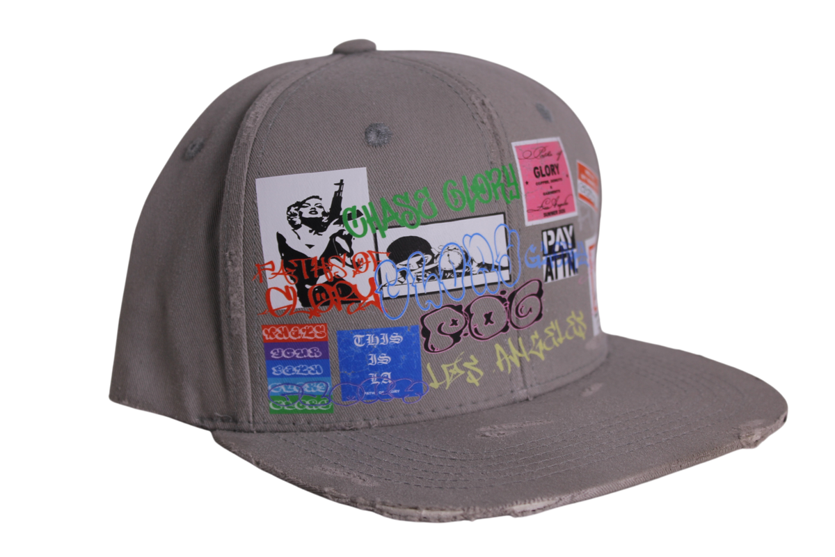 TAGGED UP HAT IN CEMENT