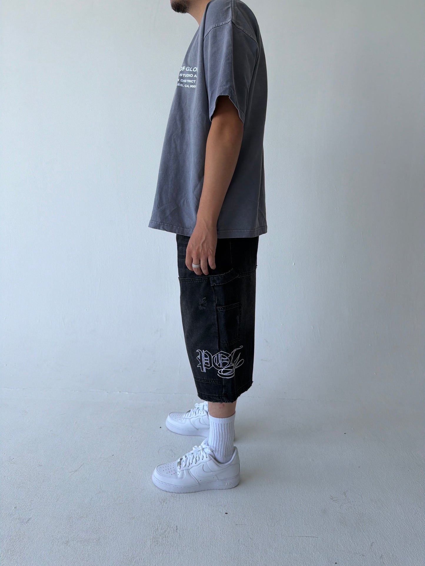 Monogram Distressed Baggy Carpenter Jorts in Black