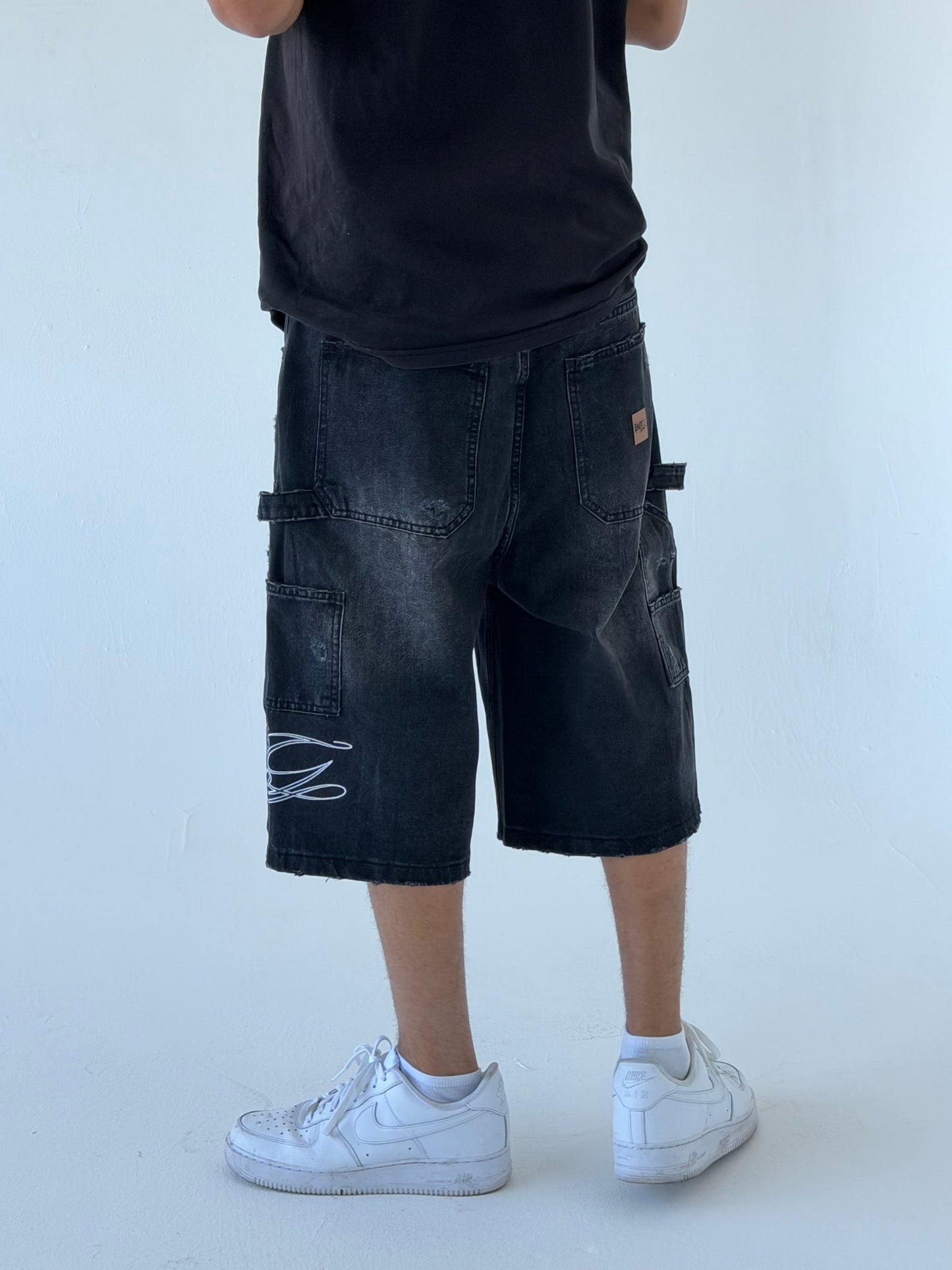 Monogram Distressed Baggy Carpenter Jorts in Black