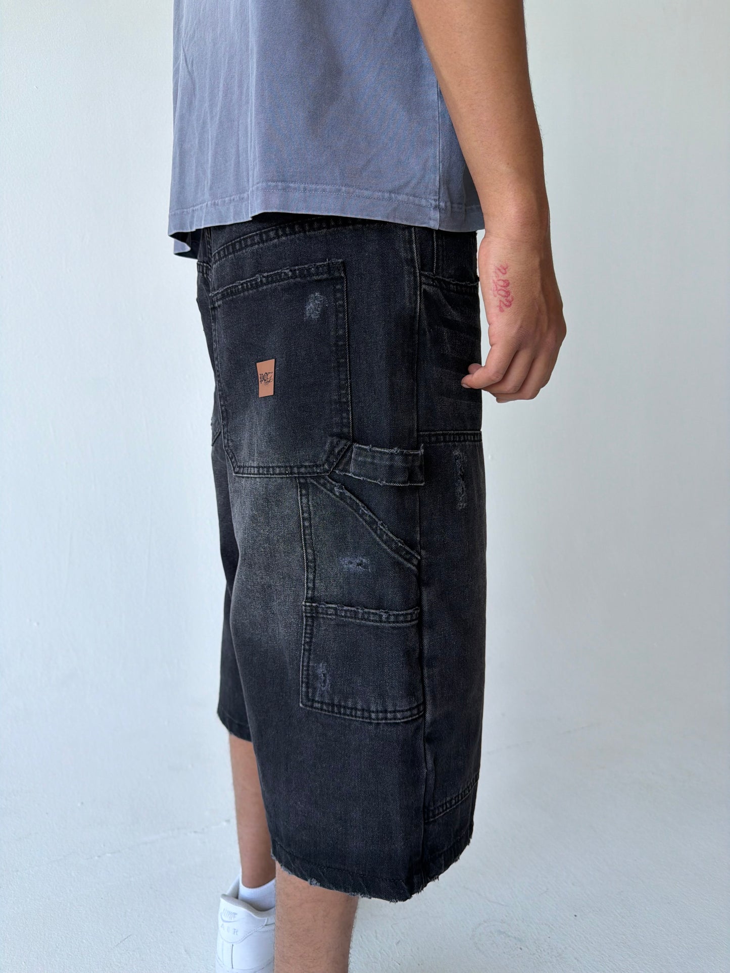 Monogram Distressed Baggy Carpenter Jorts in Black
