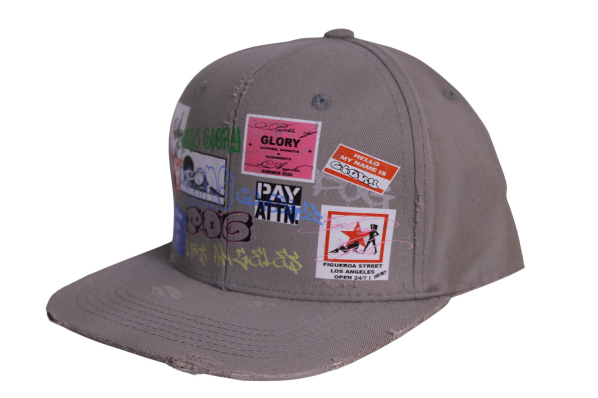 TAGGED UP HAT IN CEMENT