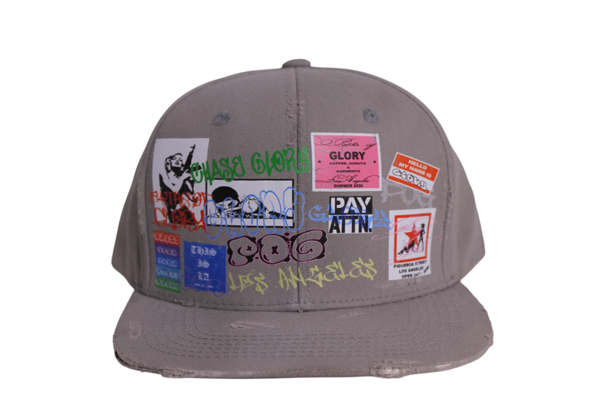TAGGED UP HAT IN CEMENT