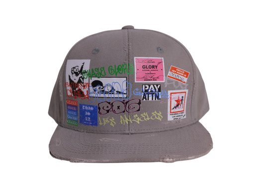 TAGGED UP HAT IN CEMENT